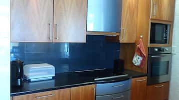 Apartment, 2 Bedrooms, Beach View | Private kitchen | Fridge, microwave, oven, stovetop