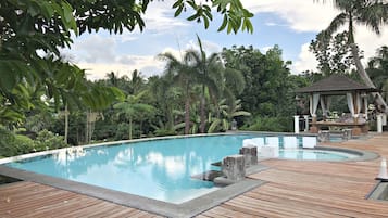 Outdoor pool, open 6 AM to 8 PM, pool loungers