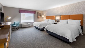 A hotel room with two beds, a desk, a chair, a TV, and a window with a view. - Hampton Inn & Suites Ruidoso Downs (Ruidoso Downs)