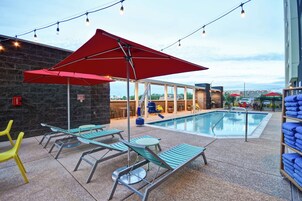 Outdoor pool, open 7:00 AM to 10:00 PM, sun loungers