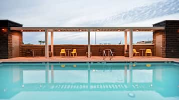 Outdoor pool, open 7:00 AM to 10:00 PM, pool loungers