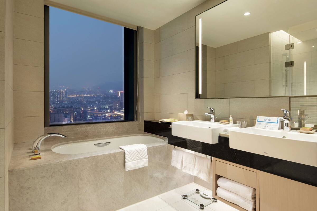 eco-friendly toiletries, hair dryer, bathrobes, slippers