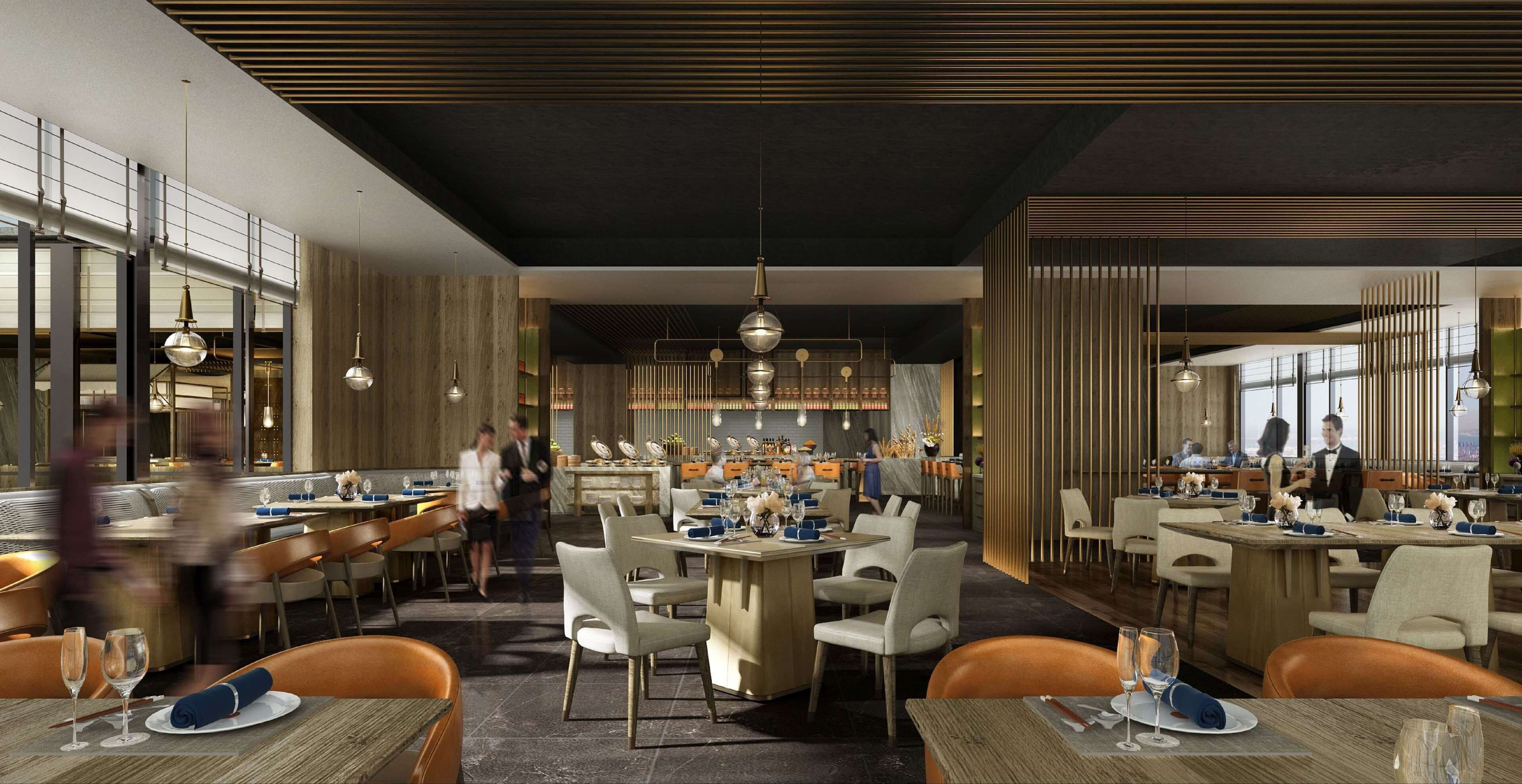 A modern restaurant interior with multiple dining areas, high ceilings, and contemporary lighting fixtures.
