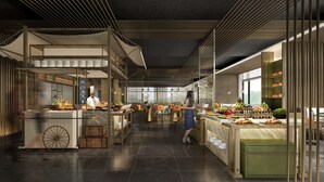 A modern restaurant with a central serving area, multiple seating options, and a view of the outdoors. - Hilton Taipei Sinban (New Taipei City)