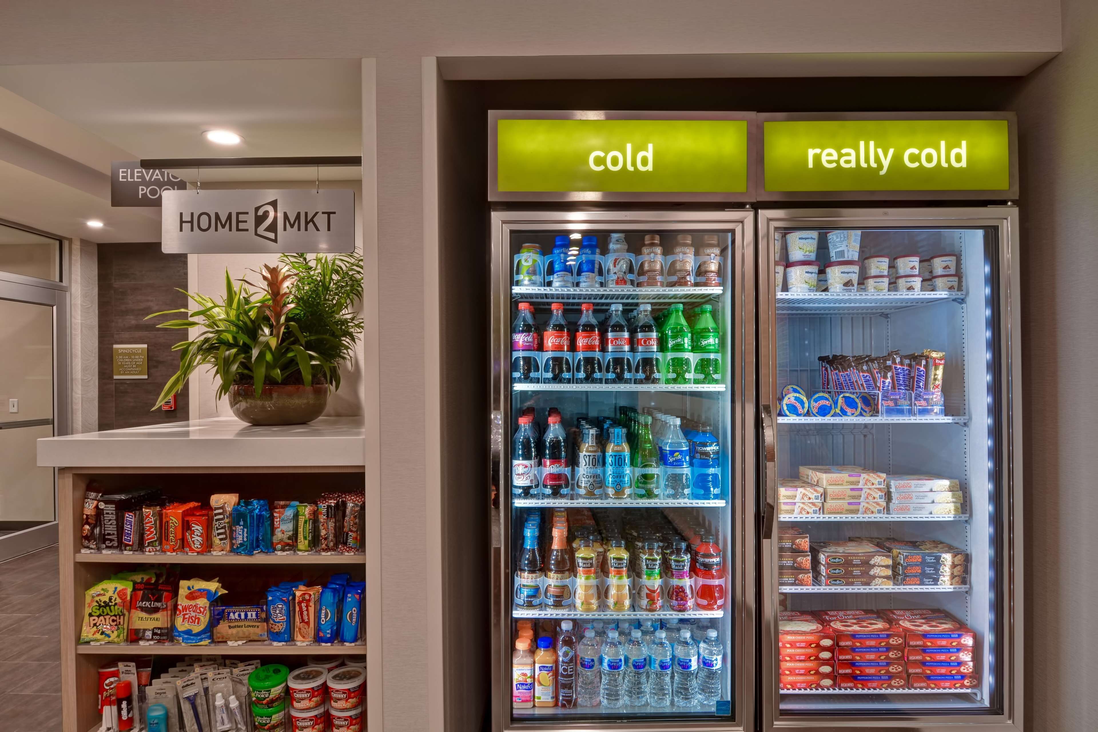 A vending machine with a variety of beverages and snacks, labeled 'cold' and 'really cold'.
