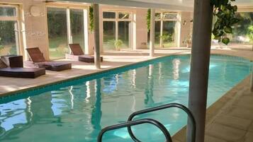 Indoor pool, open 8:30 AM to 10:00 PM, pool loungers