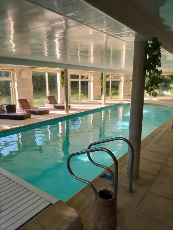 Indoor pool, open 8:30 AM to 10:00 PM, pool loungers