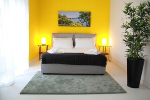 Deluxe Suite, 1 Queen Bed | Minibar, desk, laptop workspace, soundproofing