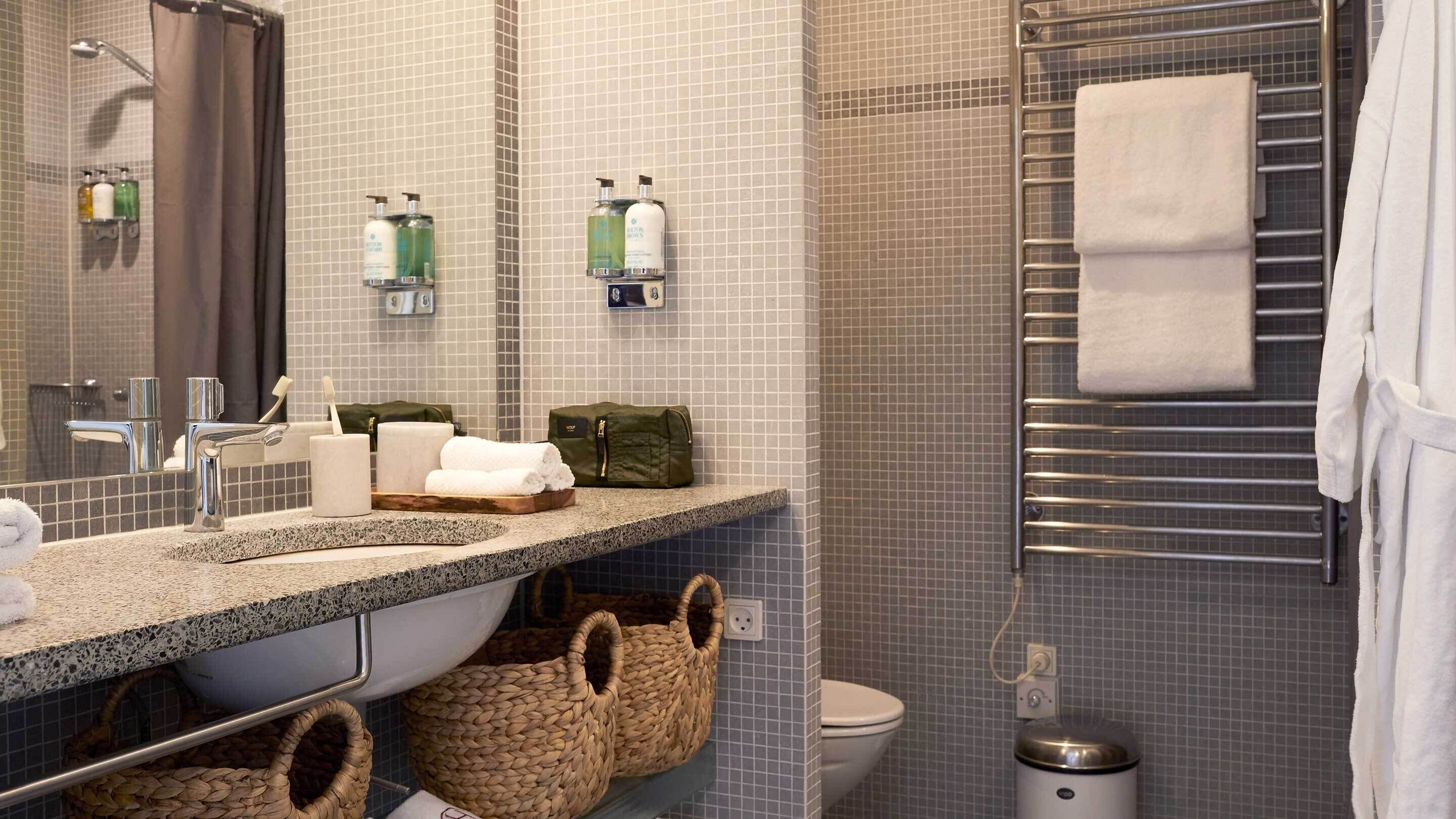 designer toiletries, hair dryer, bathrobes, towels