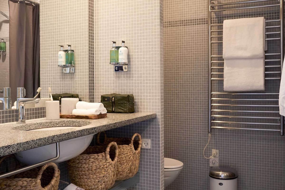 designer toiletries, hair dryer, bathrobes, towels