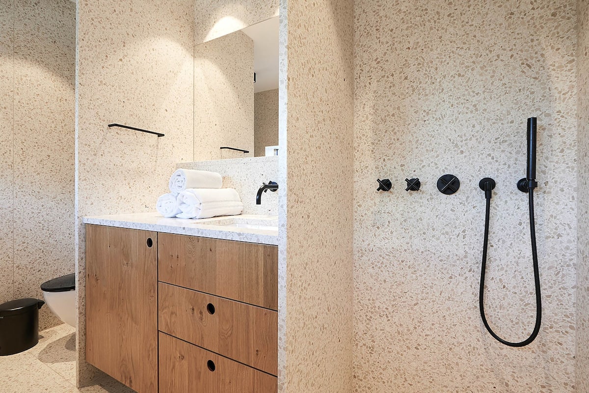 designer toiletries, hair dryer, bathrobes, towels