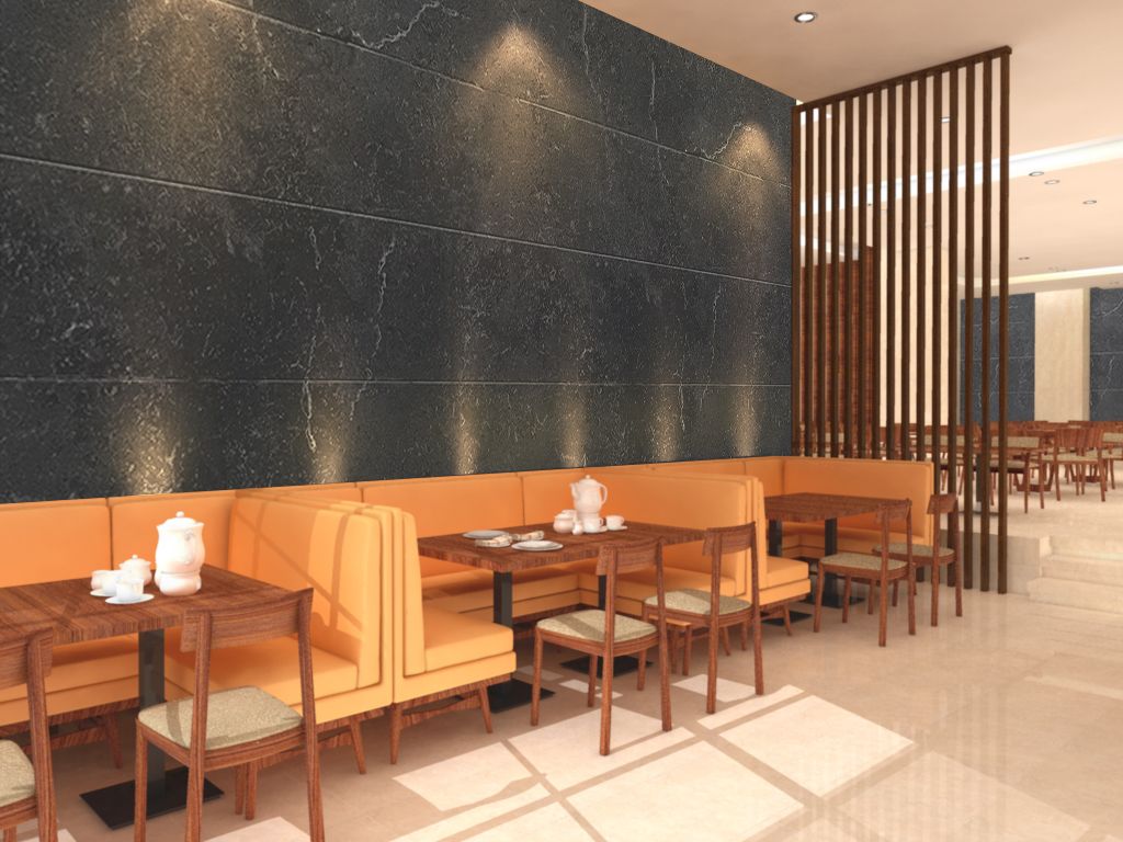 A modern hotel lobby with a black marble wall, wooden furniture, and a seating area with tables and chairs.