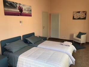 Room, 2 Twin Beds, Shared Bathroom | Desk, free cribs/infant beds, free WiFi, bed sheets - Affittacamere Le Rose (Imola)