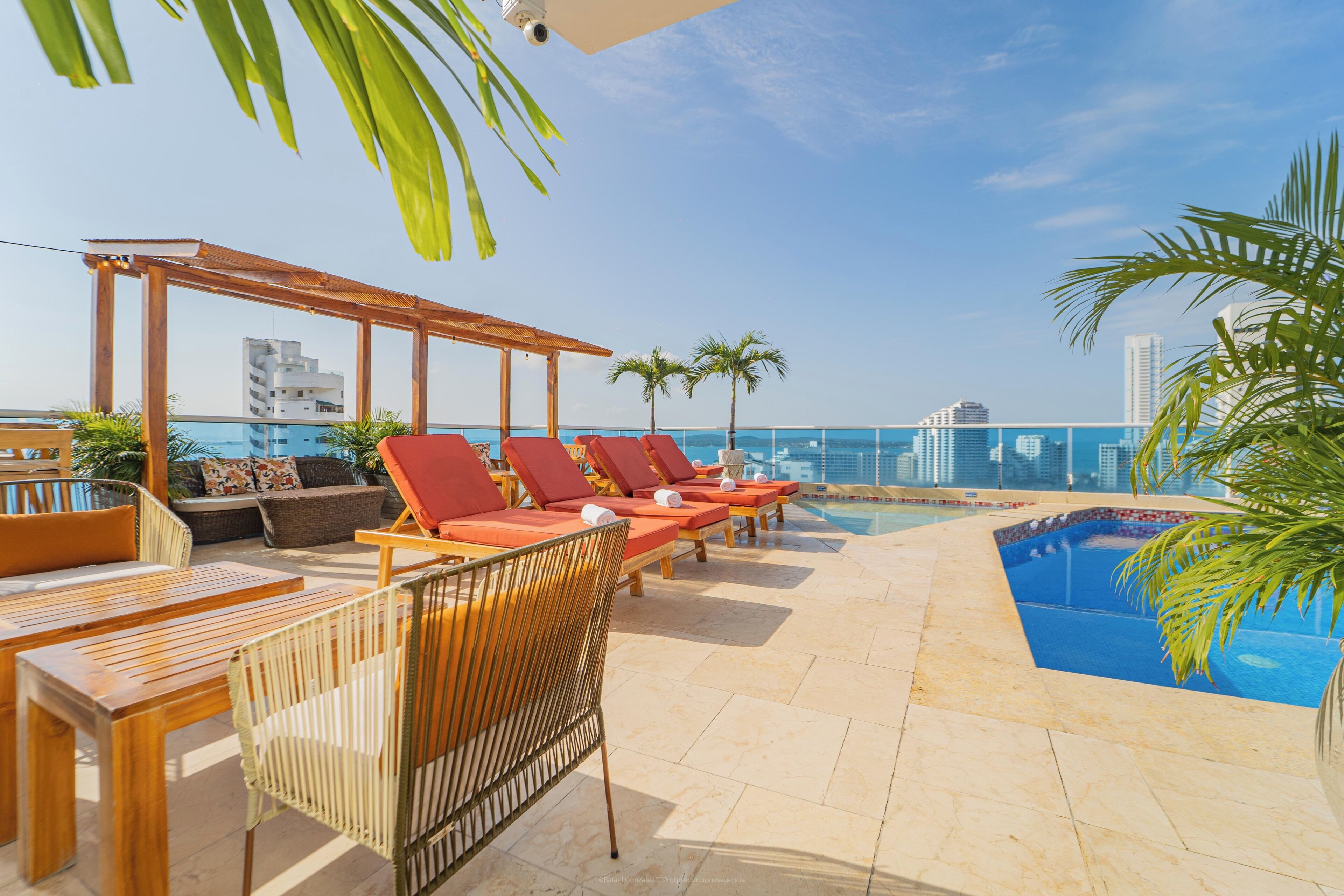 Outdoor pool, open 9:00 AM to 7:00 PM, pool umbrellas