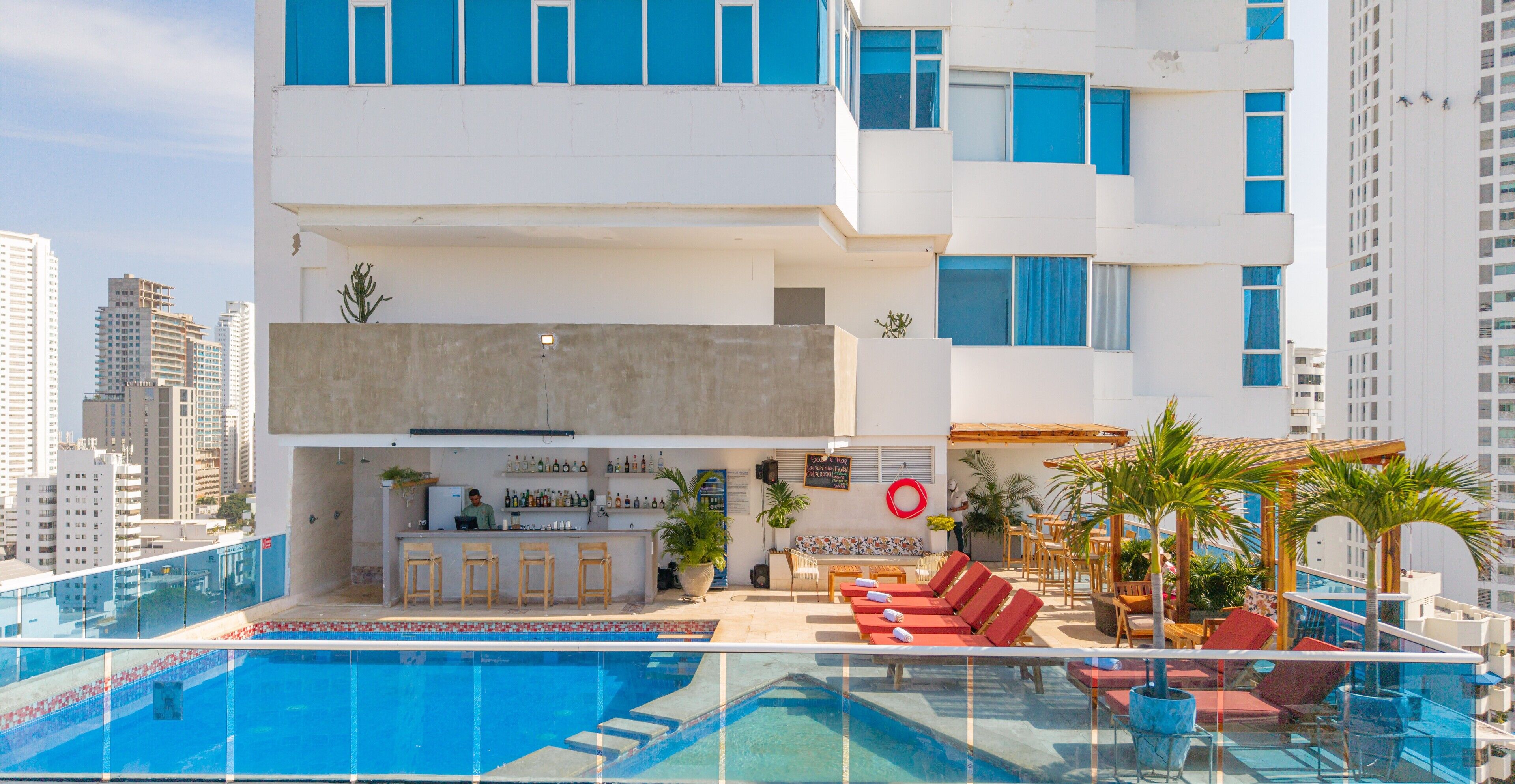 Outdoor pool, open 9:00 AM to 7:00 PM, pool umbrellas