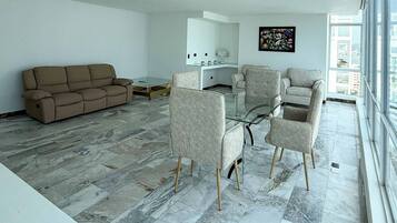 Luxury Room | Living area | Flat-screen TV