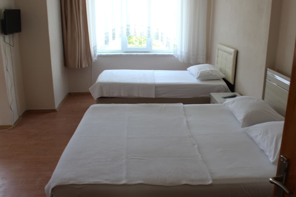 Economy Quadruple Room, Sea View | 1 bedroom, desk, free WiFi, bed sheets
