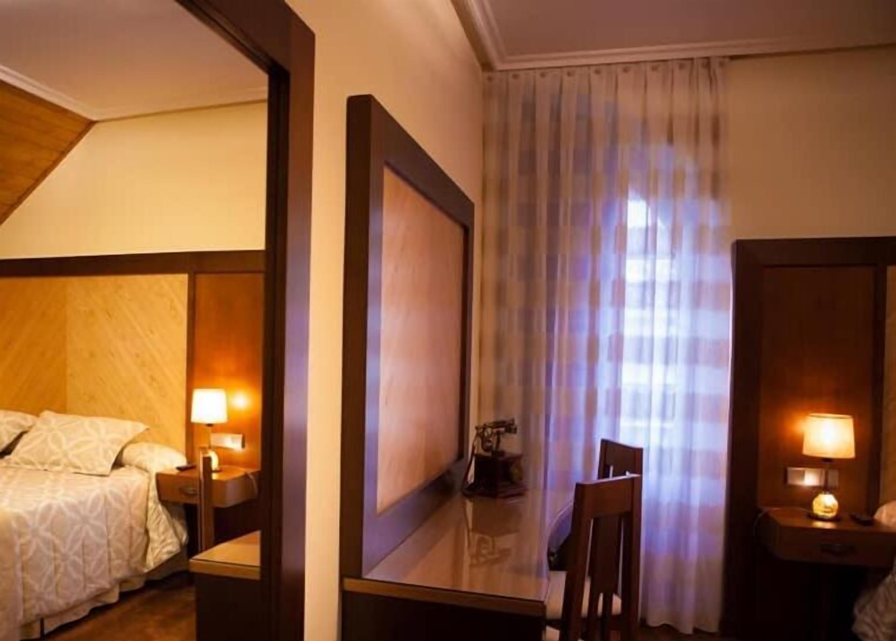 Desk, blackout drapes, soundproofing, iron/ironing board