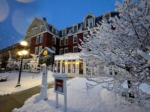 A snow-covered building with a sign reading "BRAMPTON INN". - Brandon Inn (Brandon)