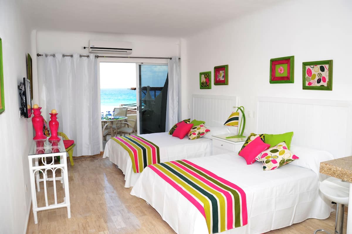 Standard Suite, 2 Double Beds, Sea View | In-room safe, free WiFi, bed sheets