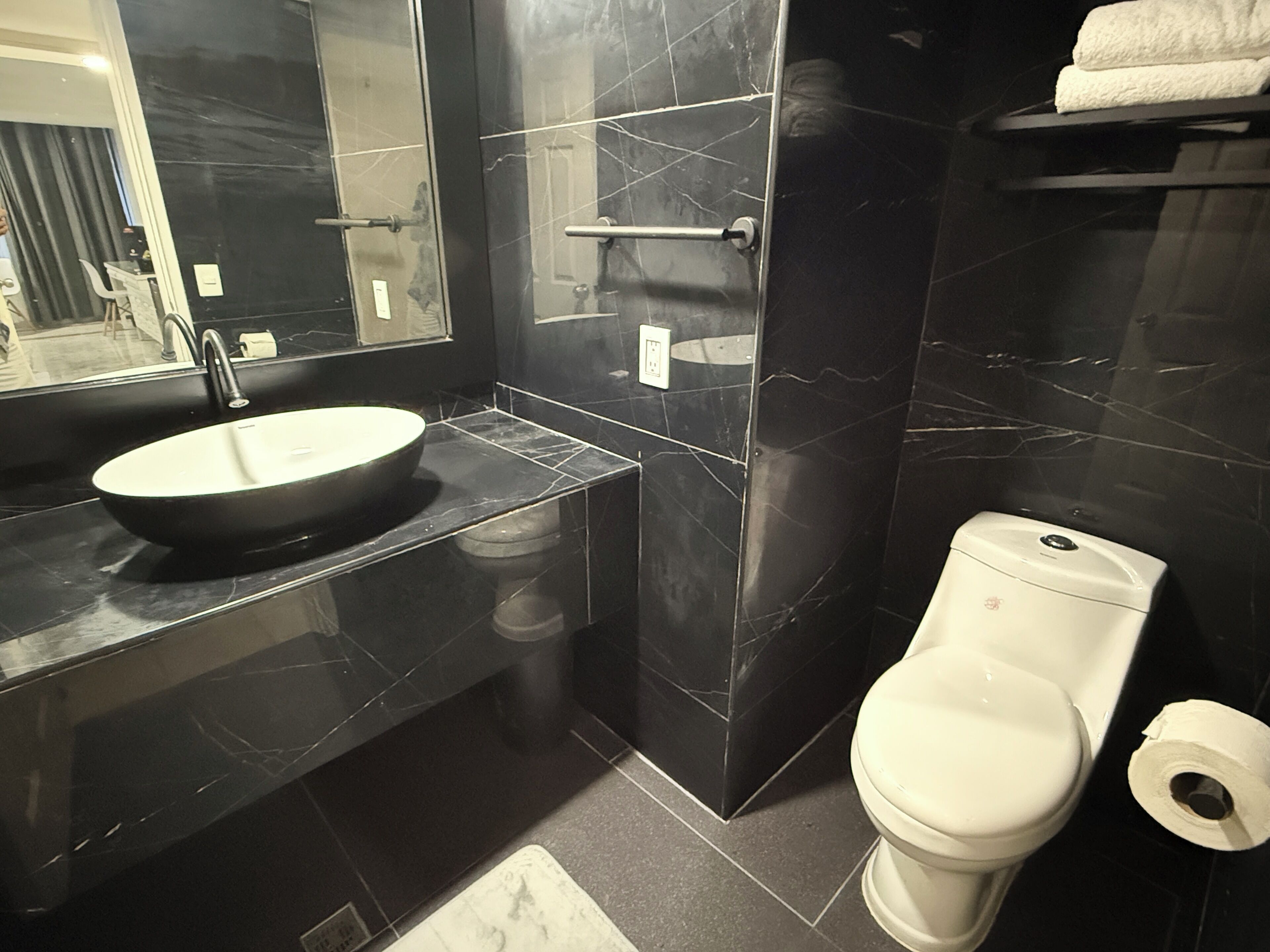 deluxe quadruple room.. | bathroom | hair dryer, towels, soap, shampoo