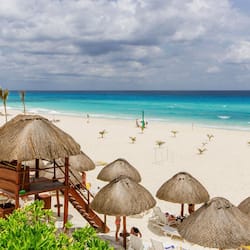 On the beach, white sand, free beach cabanas, sun loungers