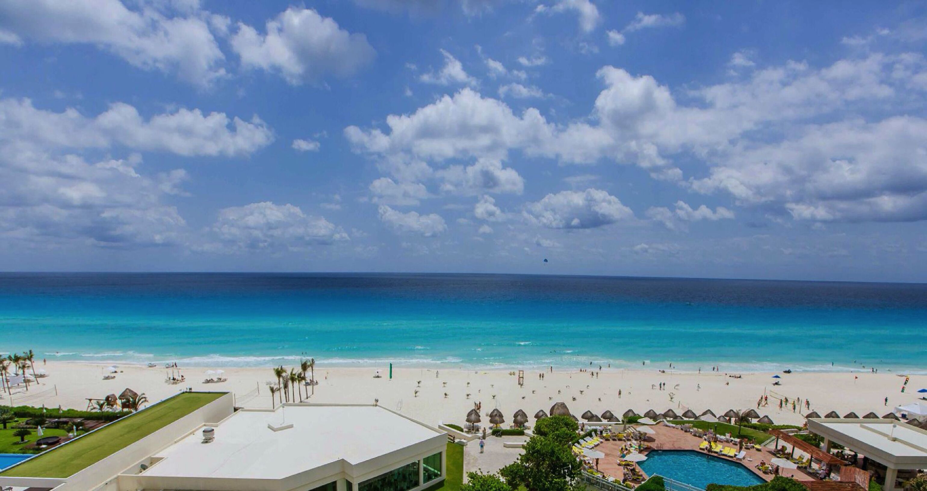On the beach, white sand, free beach cabanas, sun loungers