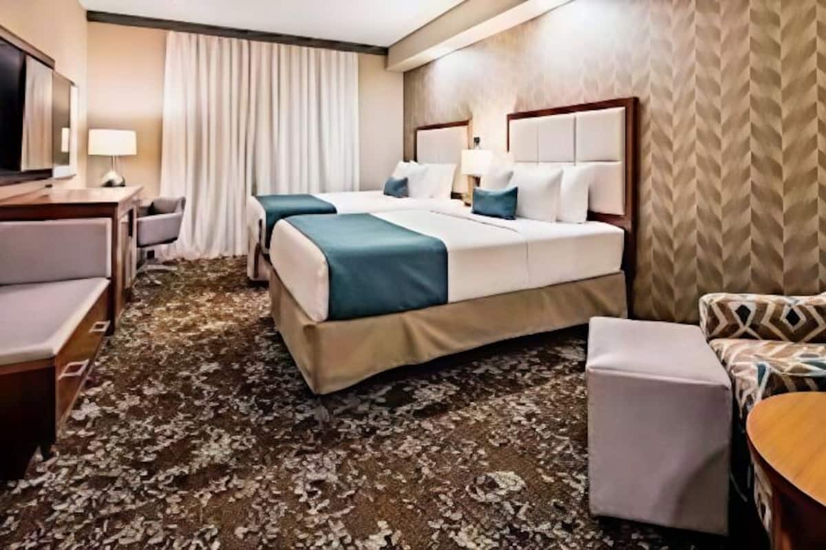 Pillowtop beds, desk, blackout drapes, iron/ironing board