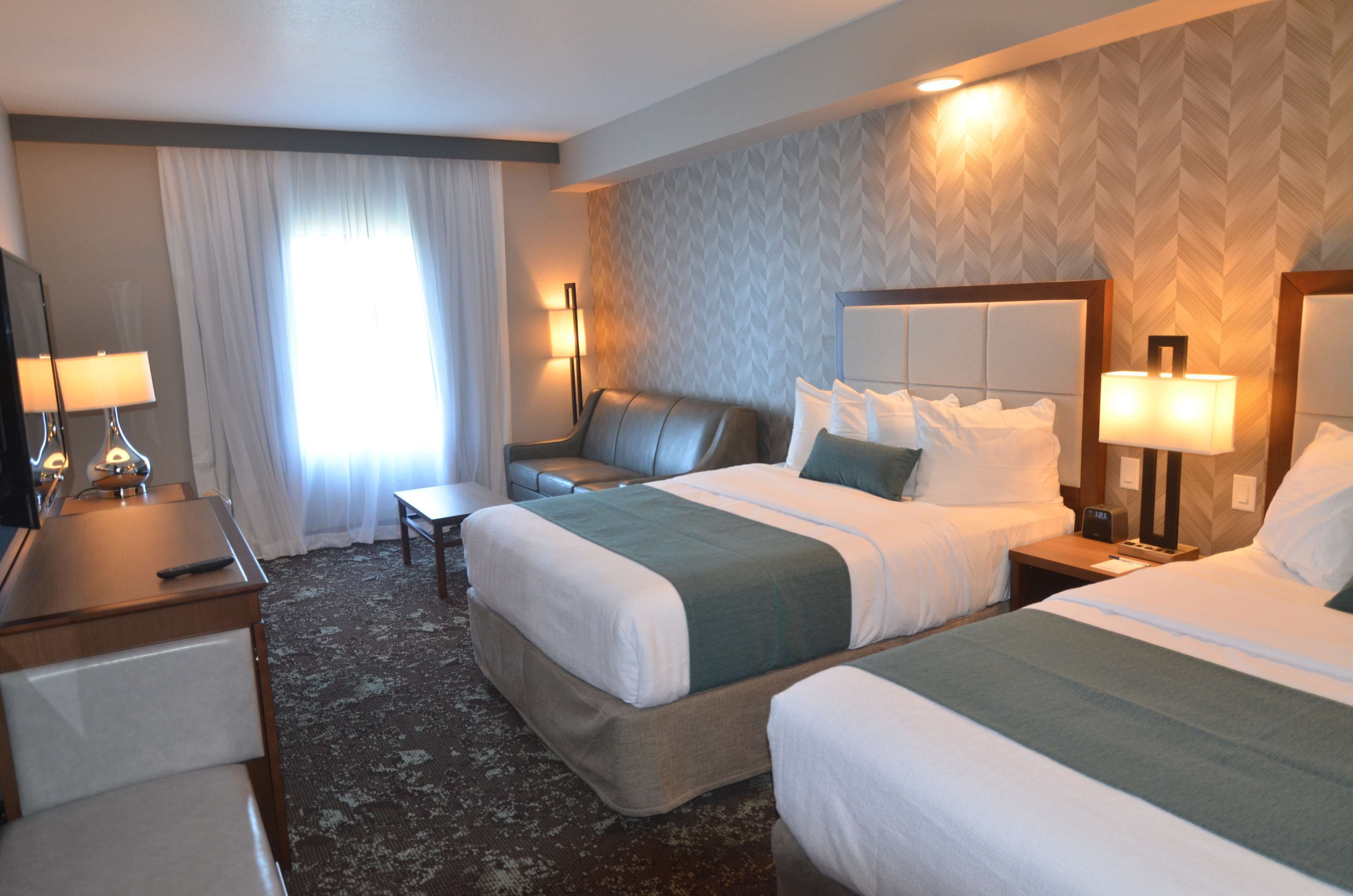 standard room, 2 queen beds, non smoking, refrigerator & microwave (larger room;with sofabed) | pillow-top beds, desk, blackout curtains, iron/ironing board