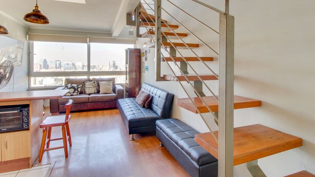 Standard Duplex | Living area | Flat-screen TV - Apart en Chile Tucapel Jimenez 76 (Santiago)