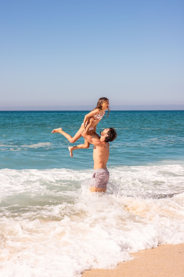 On the beach, waterskiing