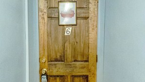 A wooden door with a number 6 sign, a small picture above it, and a doorbell. - Philip Arthur Suite, Apt #6
Hershey Penthouse overlooking all of Hershey (Hershey)