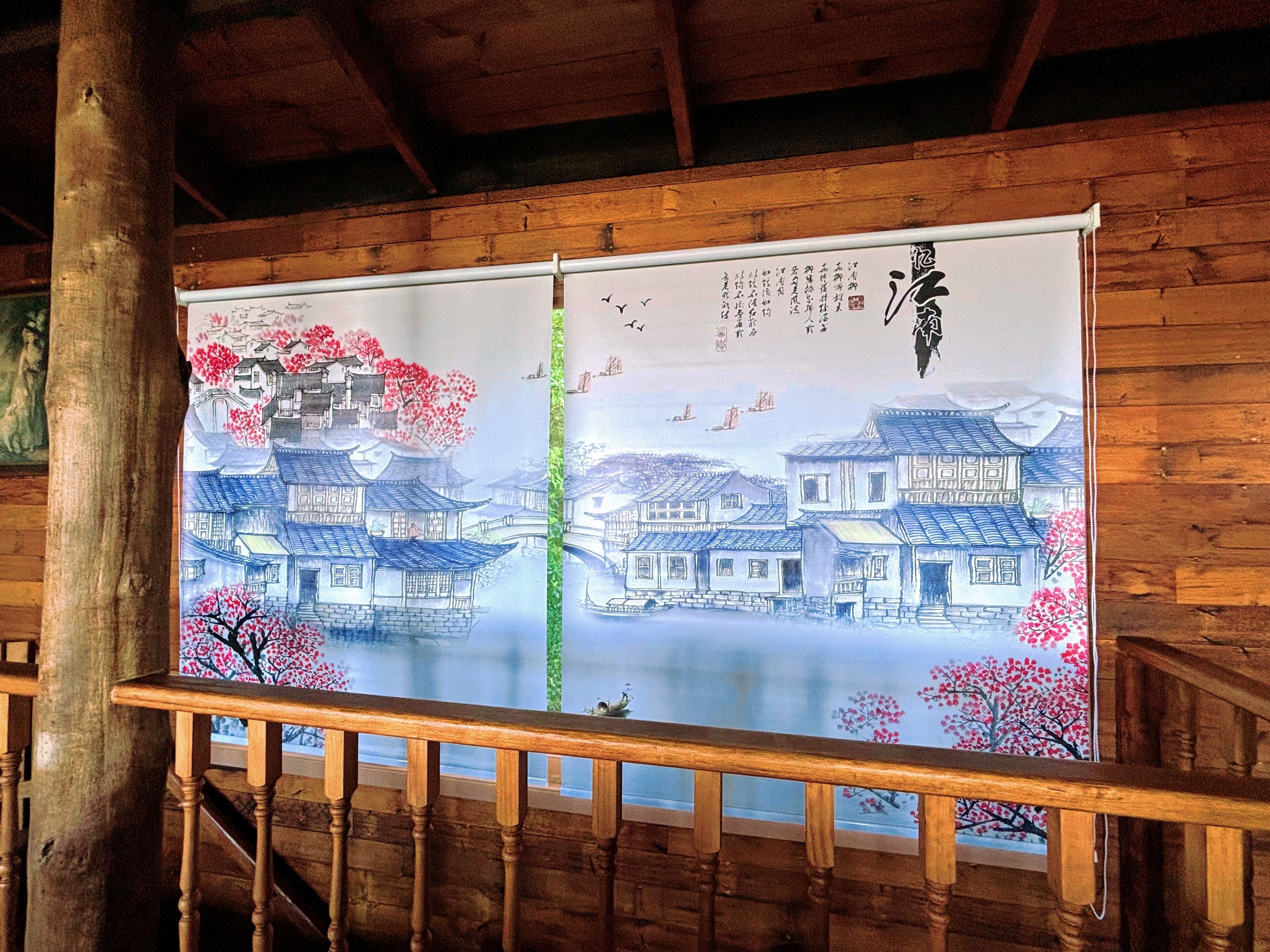 A traditional Japanese-style room with wooden beams and a wooden railing.