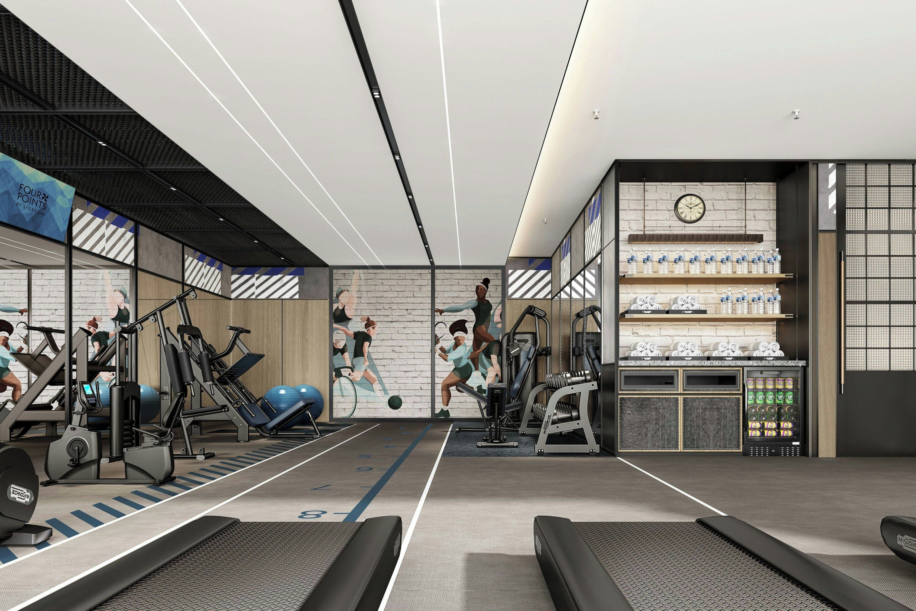 A modern gym with treadmills, exercise bikes, and weight machines.