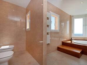Combined shower/tub, jetted tub, hair dryer, bidet