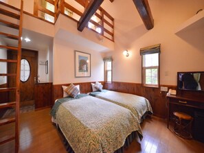 A bedroom with two beds, wooden beams, a ladder, a framed picture, and a desk with a chair. - One More Time (Nikko)