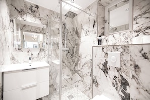 Shower, hair dryer, towels, soap