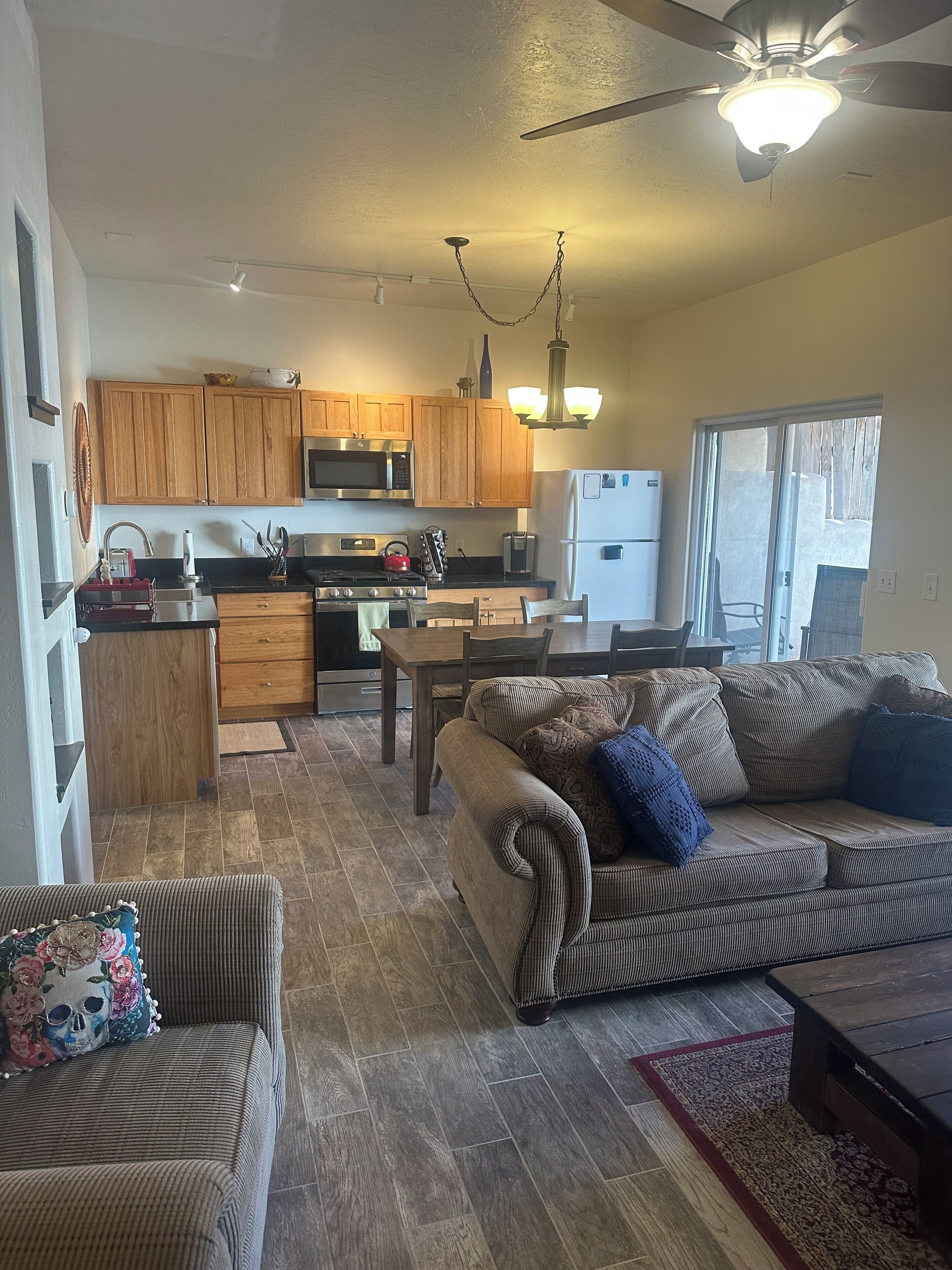 A compact living space with a kitchen, dining area, and seating area.