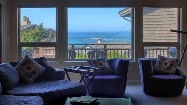 A room with a large window overlooking the ocean, furnished with a sofa and two armchairs. - Bristol By the Sea: 3  BR, 3  BA House in Cambria, Sleeps 8 (Cambria)