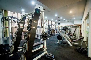 A gym with various exercise equipment, including weight machines and free weights. - Kingwood Sibu (Sibu)