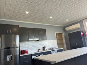 Executive Apartment | Private kitchen | Coffee/tea maker, electric kettle