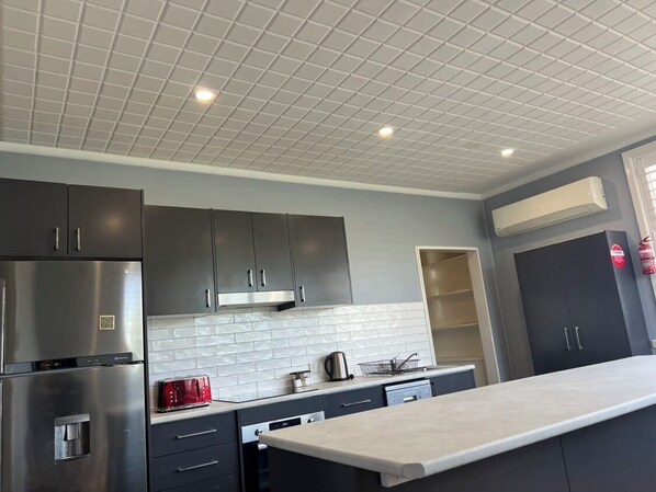 Executive Apartment | Private kitchen | Coffee/tea maker, electric kettle