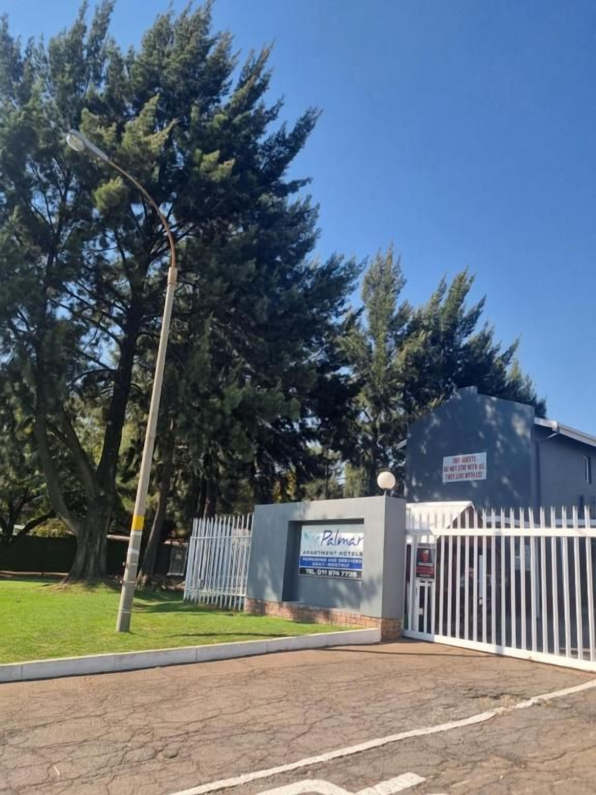 A gated entrance to a property with a sign indicating it is a residential building.