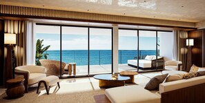 A modern hotel room with a large balcony, a sofa, a round coffee table, and a view of the ocean. - UMITO ATAMI HONTEI　 (Atami)
