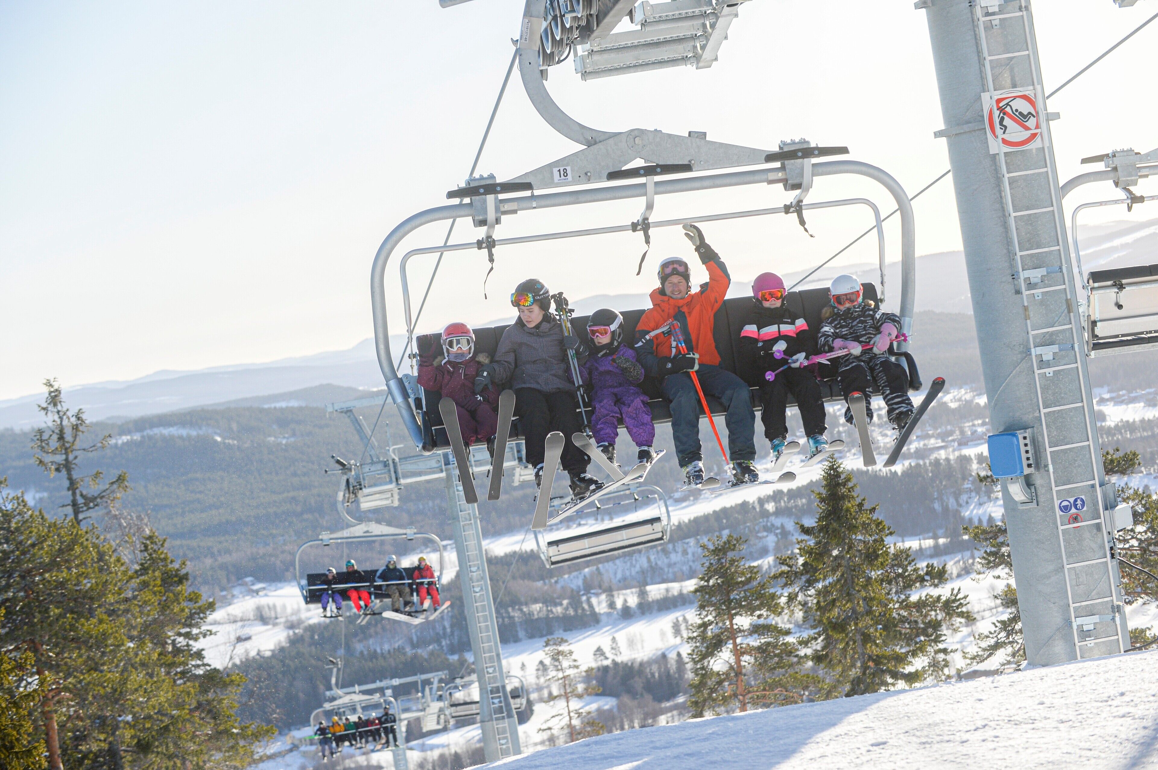 A ski lift with passengers.