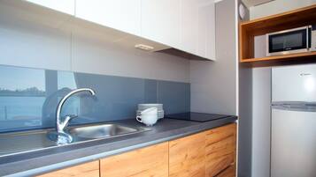 Panoramic Bungalow, 1 Bedroom | Private kitchen | Fridge, microwave, stovetop, cookware/dishes/utensils