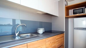 Panoramic Bungalow, 1 Bedroom | Private kitchen | Fridge, microwave, stovetop, cookware/dishes/utensils