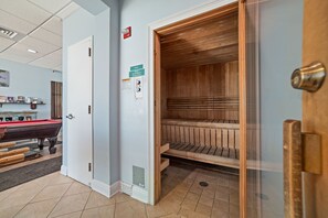 A room with a pool table, a sauna, and a door leading to another area. - NEWLY UPDATED FURNITURE! | Outdoor Pool | Hot Tub | Sauna | BEACHBALL PROPERTIES (Gulf Shores)