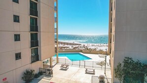A pool area with a view of the beach and ocean. - DIRECT GULF FRONT UNIT, INCREDIBLE UNCROWDED BEACHES, CONVENIENT LOCATION (Orange Beach)