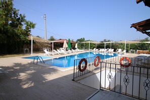 Seasonal outdoor pool, a rooftop pool, open 9 AM to 8 PM, pool umbrellas